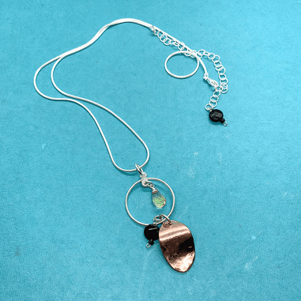 oval copper with silver circular necklace
