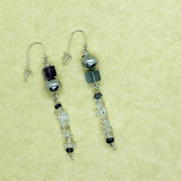 Pebble collection earrings with fluoride